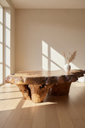 Wooden table with a natural, rustic finish on a wooden floor.